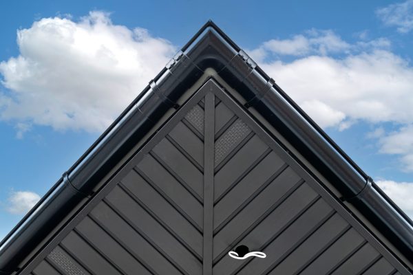 A modern graphite herringbone roof lining is attached to the trusses, visible cables and holes for LED lighting.