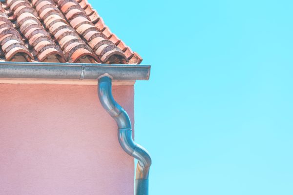Rain gutter on rustic mediterranean house with copy space